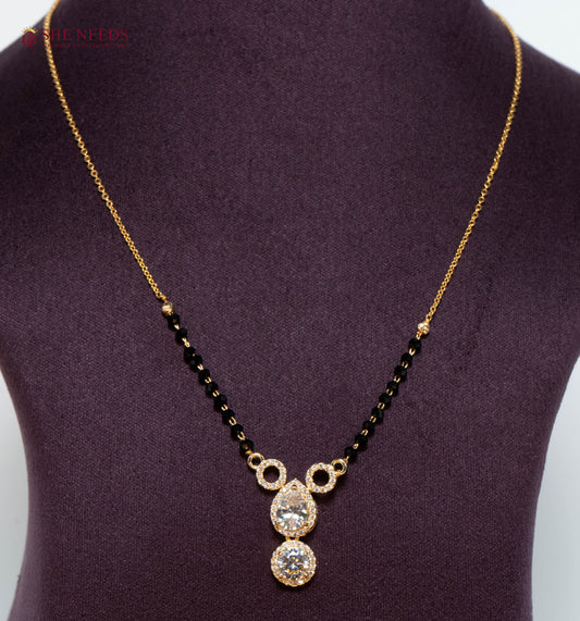 Aarini American Diamond Mangalsutra with Double Drop CZ Pendant and Black Beads in Gold Plated Finish