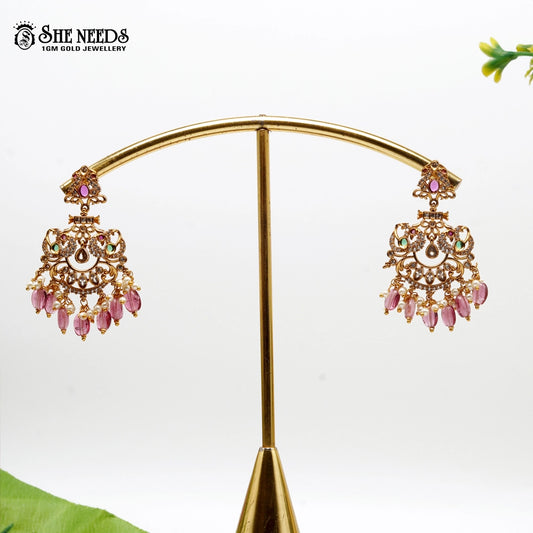“Matte gold Chandbali earrings with pearl drops and pink bead accents – SheNeeds Jewellery