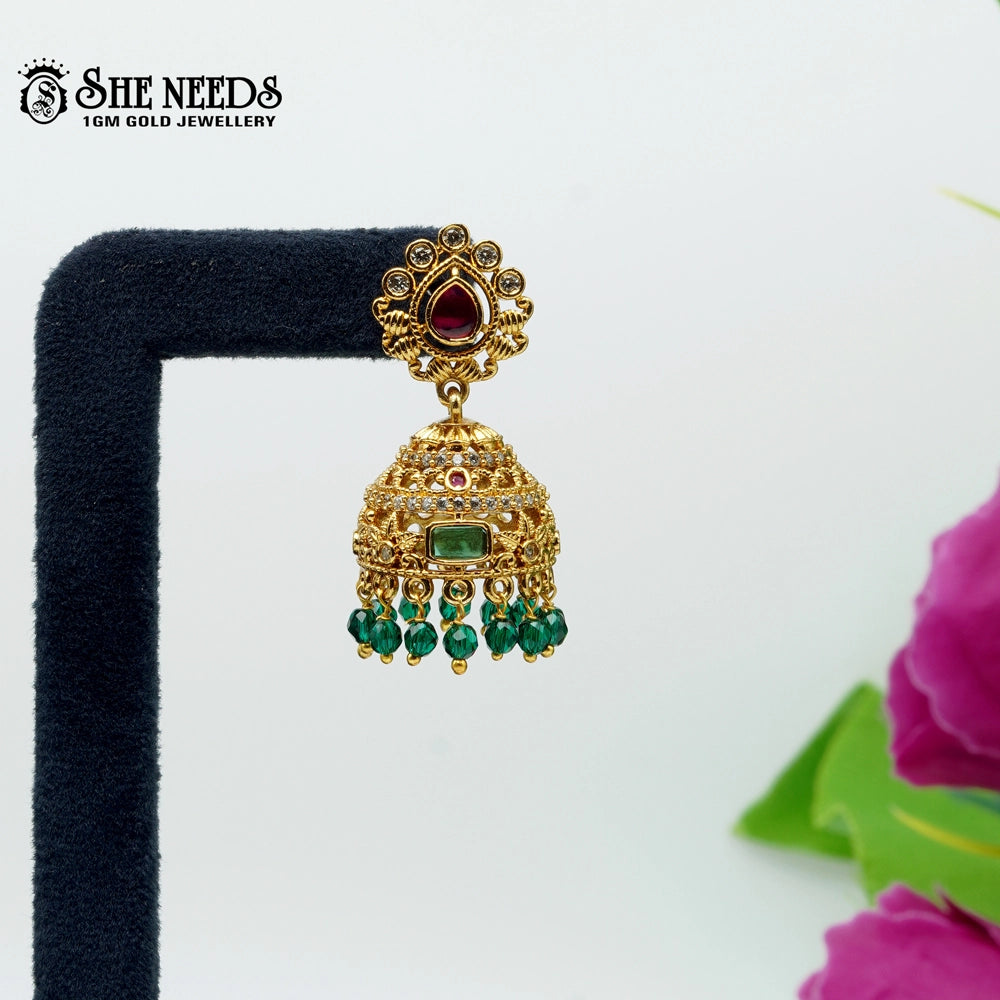 Traditional gold plated South Indian jhumka earrings with green beads and red stone detailing