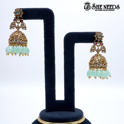 Gold plated light green bead jhumkas traditional earrings for women