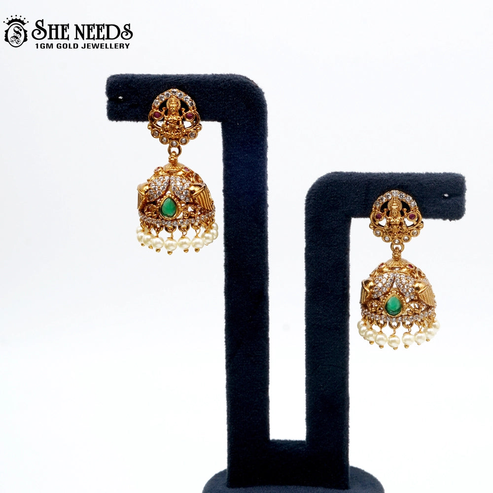 Lakshmi idol temple jhumka earrings with green stone and pearl drops – traditional South Indian jewellery