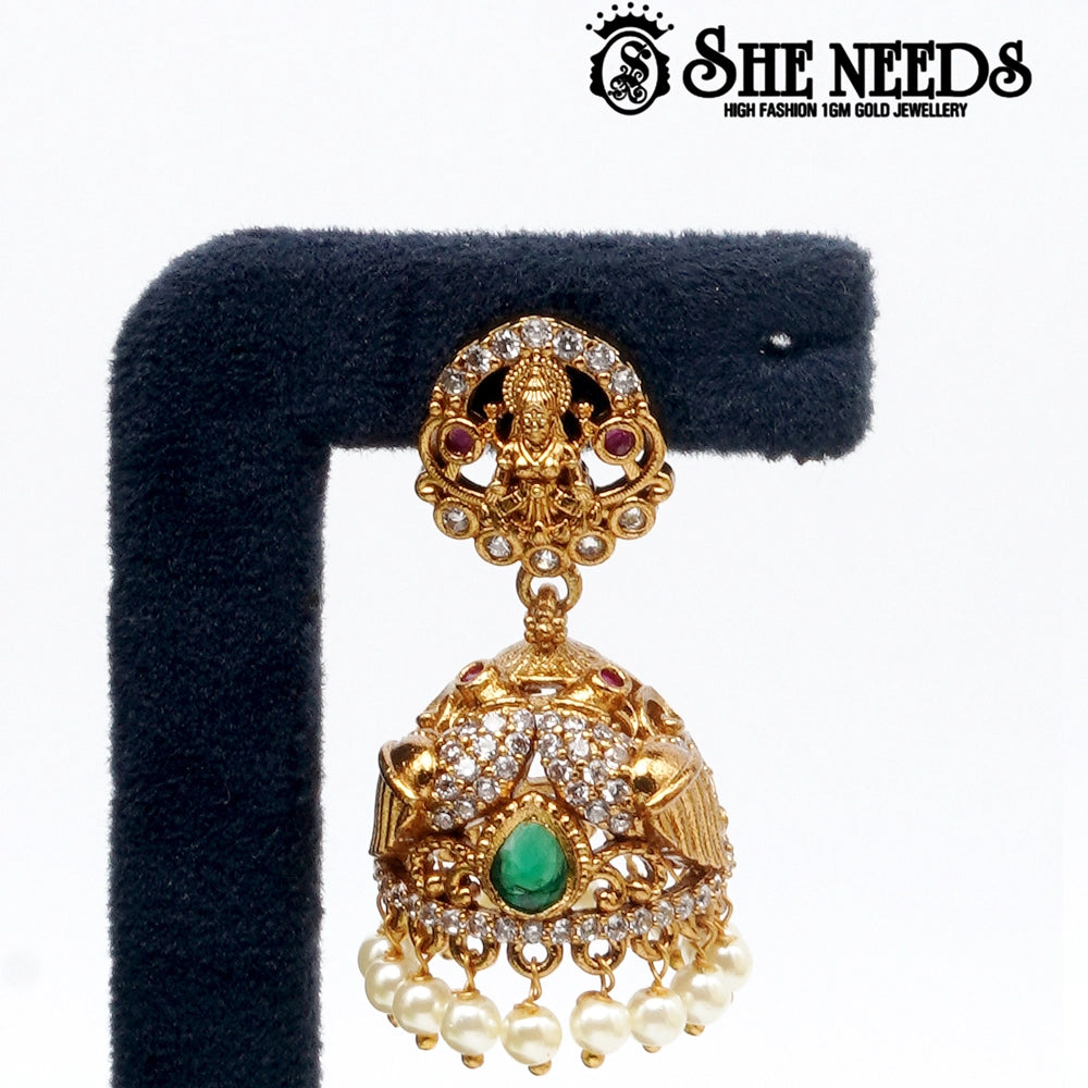 Lakshmi idol temple jhumka earrings with green stone and pearl drops – traditional South Indian jewellery