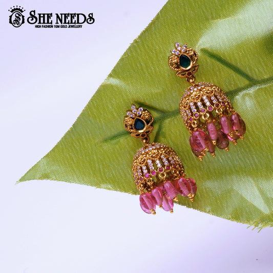 Lakshmi idol temple jhumka earrings with green stone and pearl drops – traditional South Indian jewellery