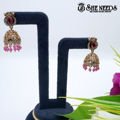 Oval stone temple jhumka earrings with pearl drops- sheneedsjewellery