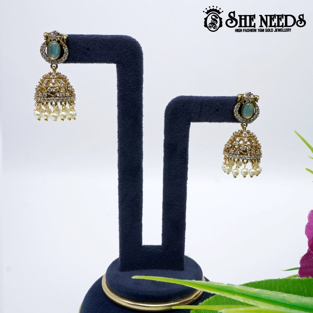 Oval stone temple jhumka earrings with pearl drops- sheneedsjewellery