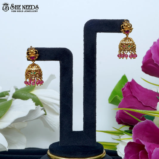 Traditional gold plated South Indian jhumka earrings with pink beads and temple jewellery stone detailing