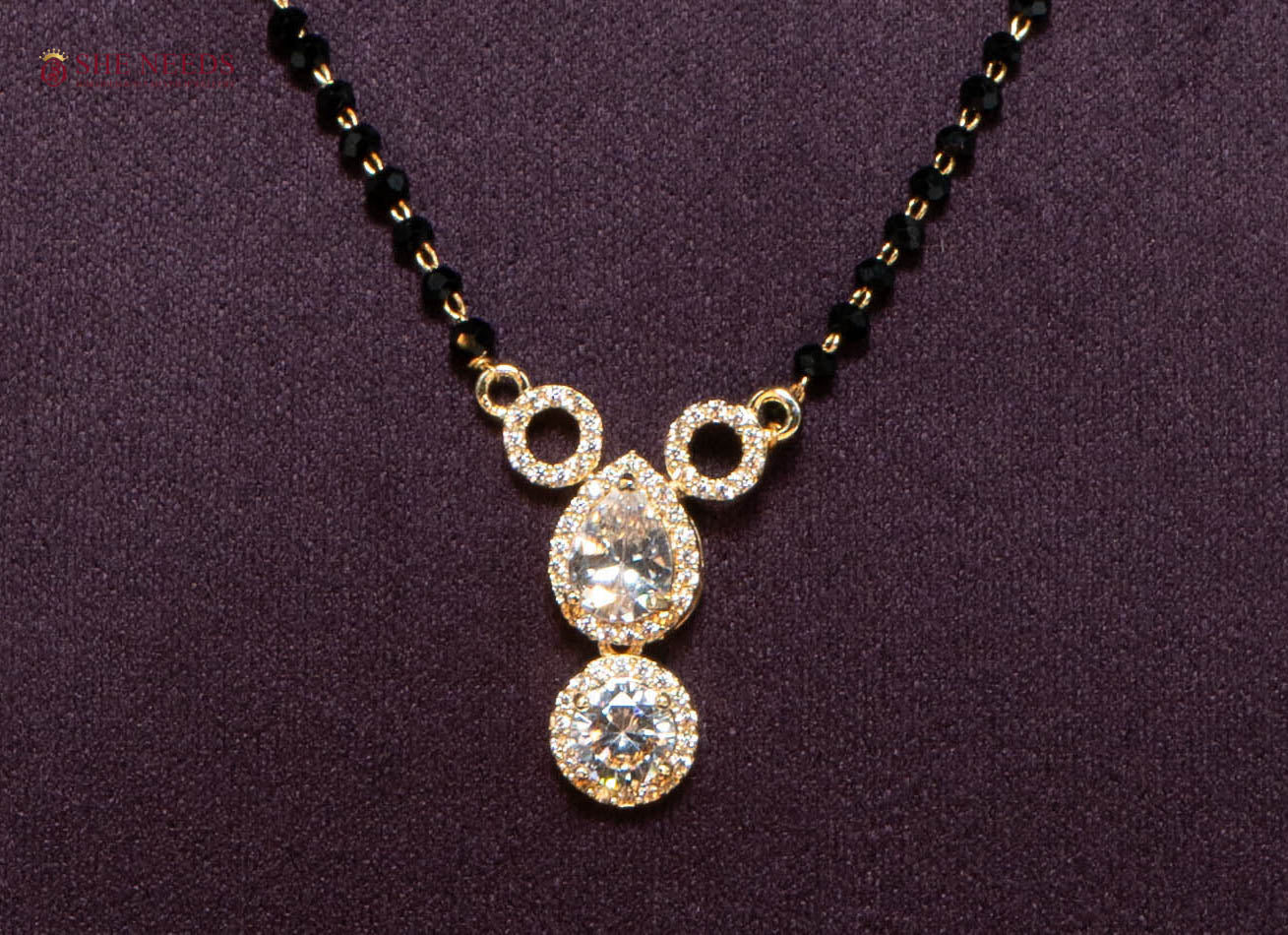 Aarini American Diamond Mangalsutra with Double Drop CZ Pendant and Black Beads in Gold Plated Finish