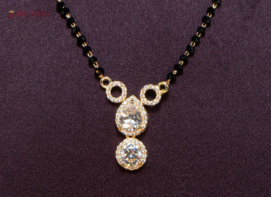 Aarini American Diamond Mangalsutra with Double Drop CZ Pendant and Black Beads in Gold Plated Finish