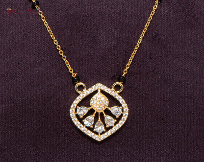 Aarini Bloom American Diamond Mangalsutra Necklace with Floral Heart CZ Pendant and Black Beads in Gold Plated Finish
