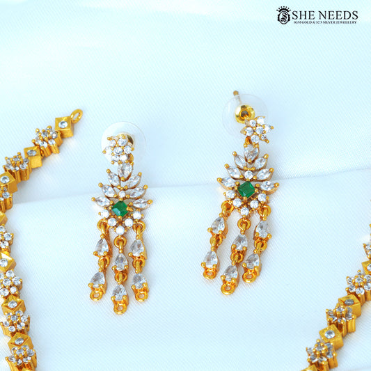 Aarvika green geometric drop earrings with white stones and gold-polished detailing|She Needs Jewellery

