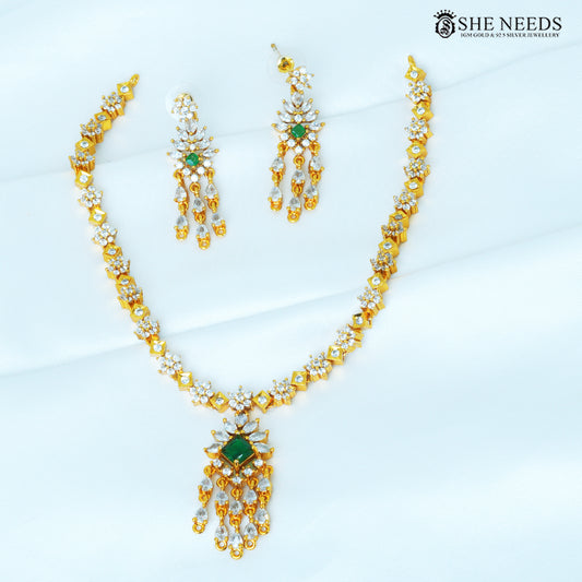 Aarvika green geometric necklace set with matching drop earrings, featuring green and white stones in a gold-polished design|She Needs Jewellery
