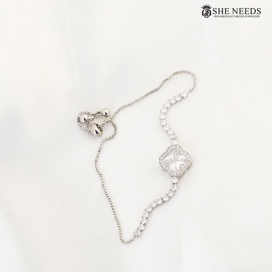 Silver-tone adjustable CZ bracelet featuring a cushion-cut center stone, sparkling crystal accents, and a sliding adjustable chain closure on a white background |She Needs Jewellery