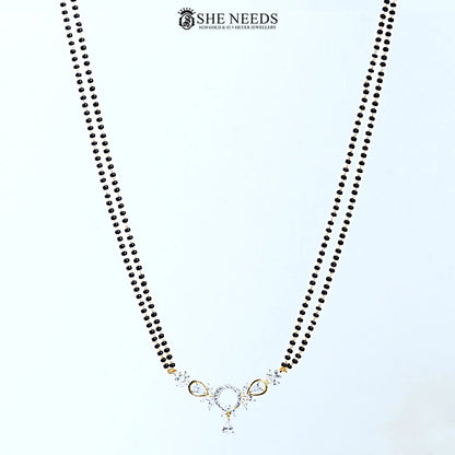 Full view of Anvika Gold Plated AD Halo Mangalsutra with a halo-inspired American Diamond pendant, black bead chain, and elegant gold-plated finish.|She Needs Jewellery
