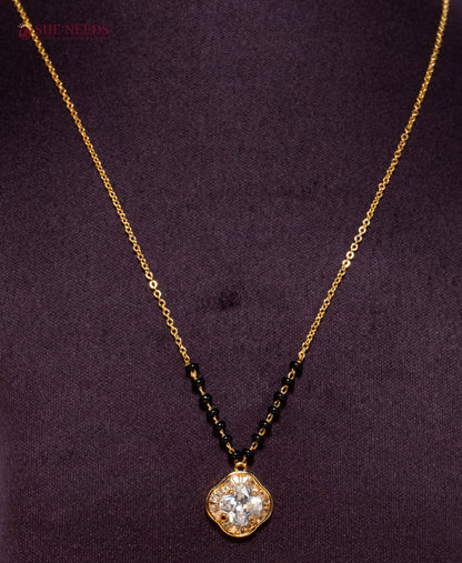 Shop the Clover American Diamond Mangalsutra Necklace featuring a sparkling clover-shaped CZ pendant, premium gold plating, and traditional black beads. Perfect for daily wear, office wear, festive occasions, and gifting.