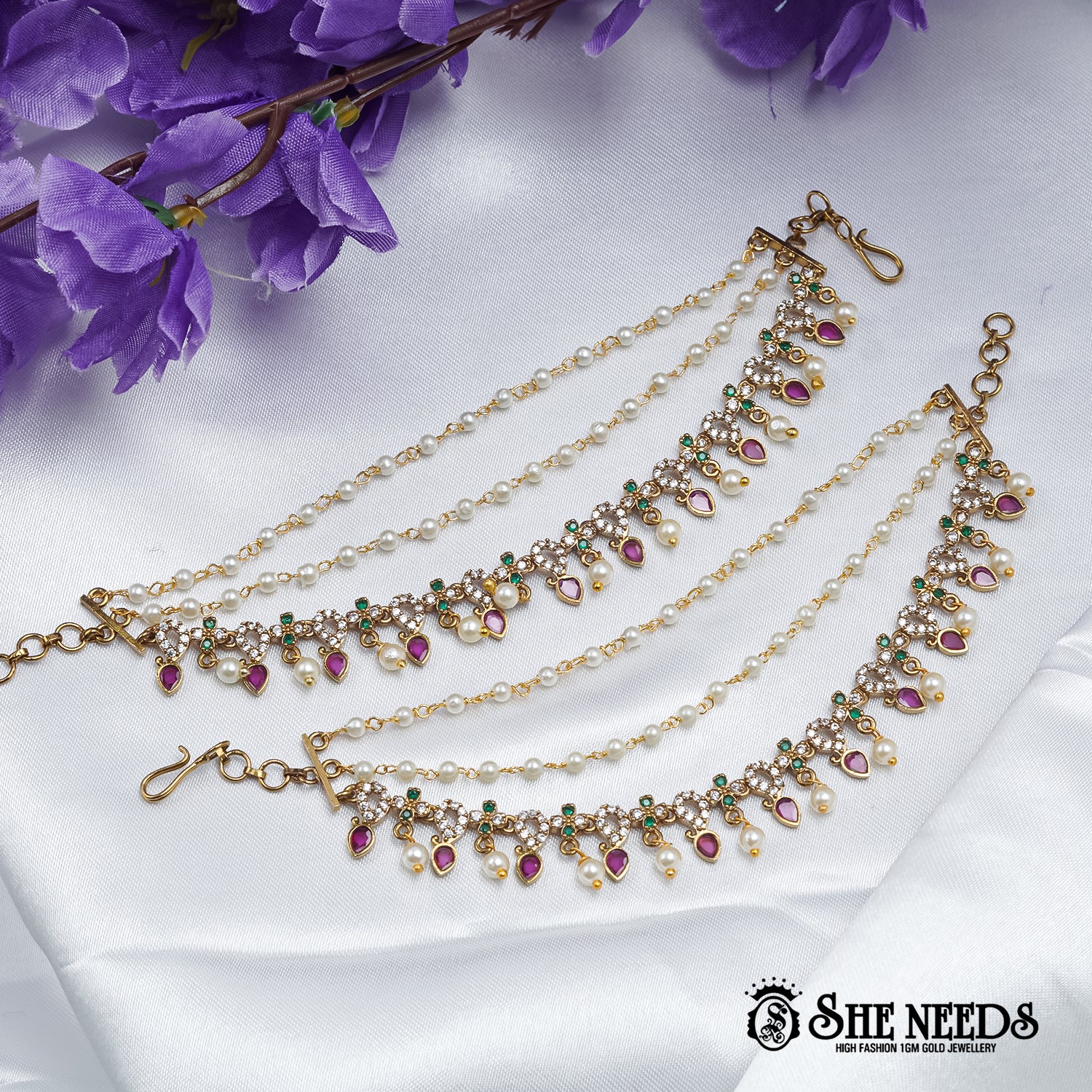 Champasaralu royal teardrop pearl payal with pink stone detailing and gold polish
