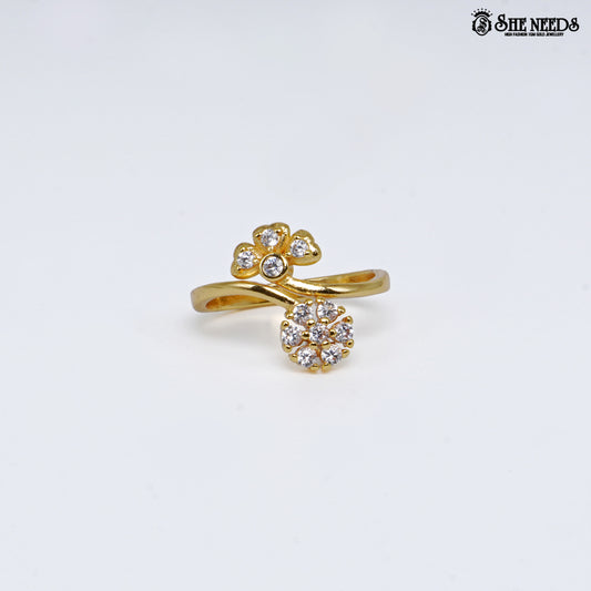 Gold-plated adjustable open ring featuring dual floral cubic zirconia clusters connected by an elegant crossover band on a white background.|She Needs Jewellery
background.