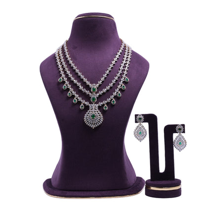 Emerald Cascade Royale Silver Plated Multi Layer American Diamond Necklace Set with Emerald Green Stones and Matching Earrings | She Needs Jewellery
