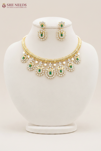 Emerald Green American Diamond Stone Choker Necklace Set with matching earrings featuring sparkling CZ stones, emerald green teardrop stones, and gold finish | She Needs Jewellery