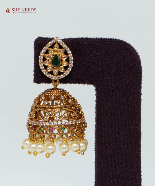 Gold Plated Emerald Pearl Dome Jhumka Earrings with American Diamonds, emerald-green stone, multicolor accents and pearl drops by She Needs Jewellery