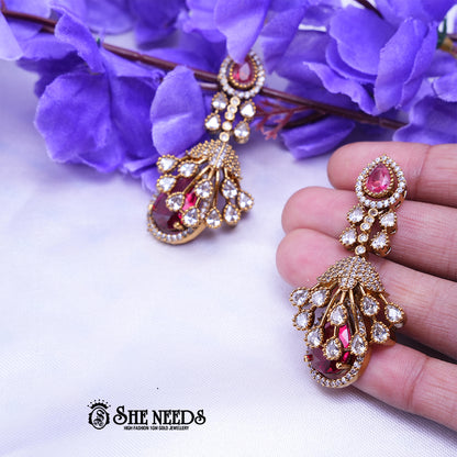 Elegant emerald Red long drop earrings with American diamonds and gold polish from She Needs Jewellery