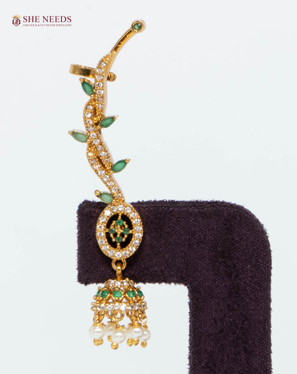 Gold-plated emerald vine ear cuff jhumka earring with green stones, American Diamonds, and pearl drops for bridal and festive wear.|She Needs Jewellery
