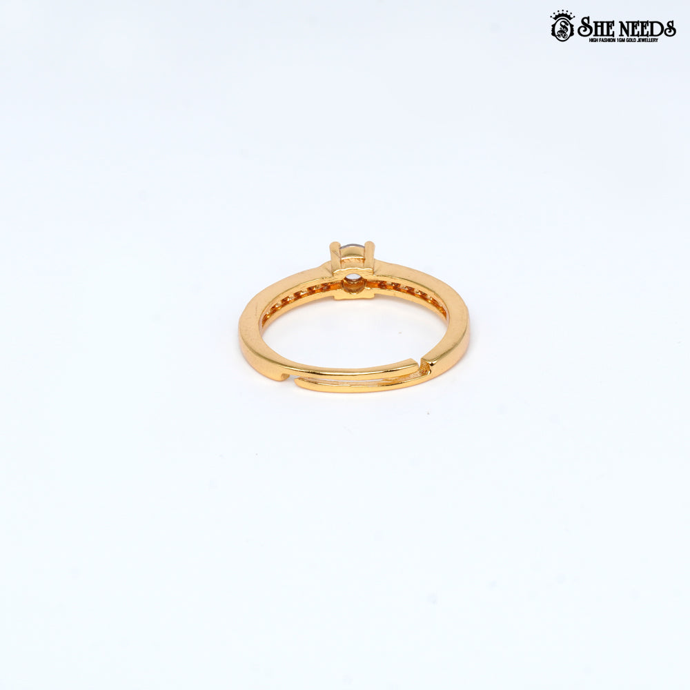Gold-plated adjustable solitaire ring featuring a round-cut cubic zirconia center stone and pavé-set CZ stones on the band against a white background |She Needs Jewellery