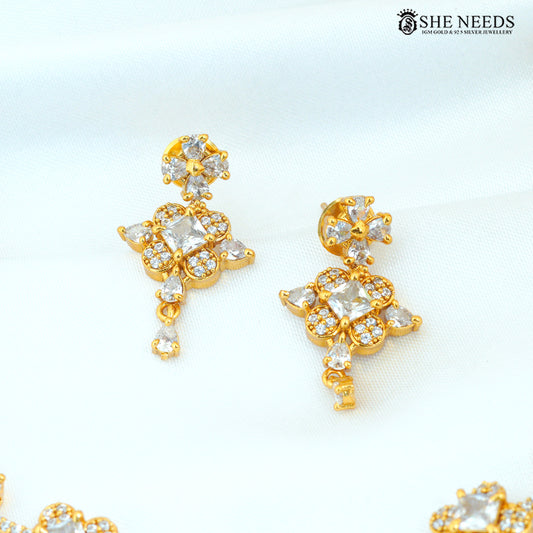 Gold polish floral American Diamond drop earrings with sparkling white stone detailing|She Needs Jewellery
