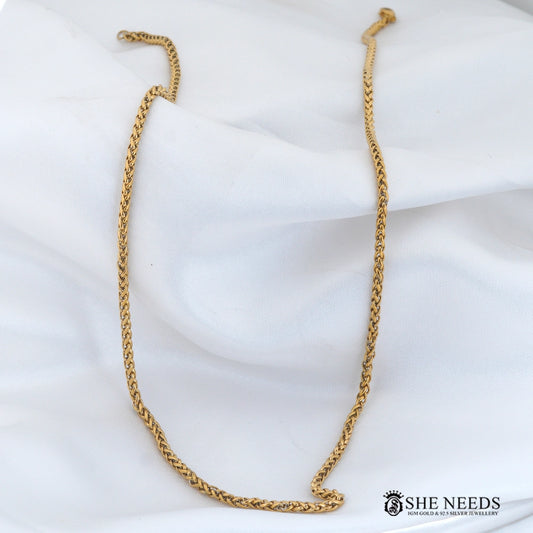 Gold finish men's chain necklace featuring a stylish braided link design, secure clasp closure, and premium polished finish displayed on a white fabric background.