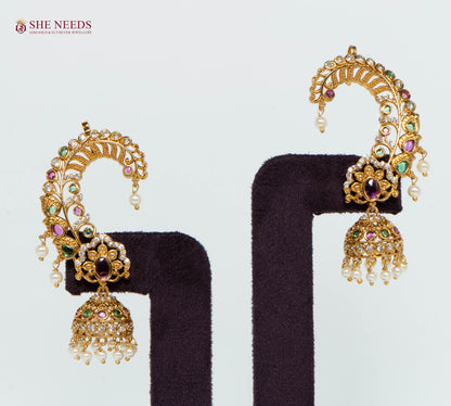 Gold multicolor floral ear cuff jhumka earrings with sparkling American Diamonds, multicolor stones, intricate floral detailing, and pearl drop danglers for bridal and festive wear.|She Needs Jewellery

