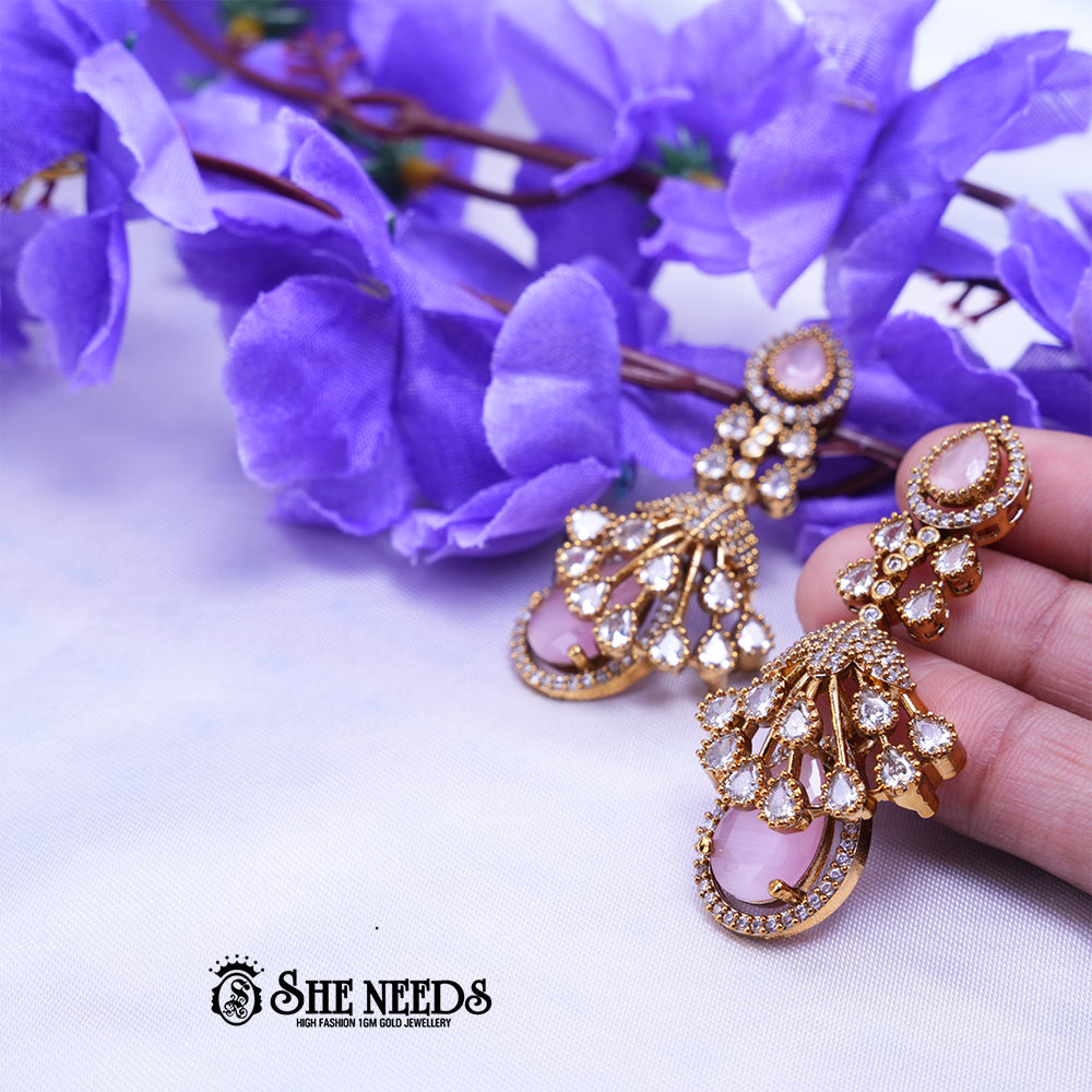 Gold Plated American Diamond Light Pink Statement Drop Earrings featuring sparkling CZ stones and elegant light pink teardrop stones with a premium gold finish | She Needs Jewellery