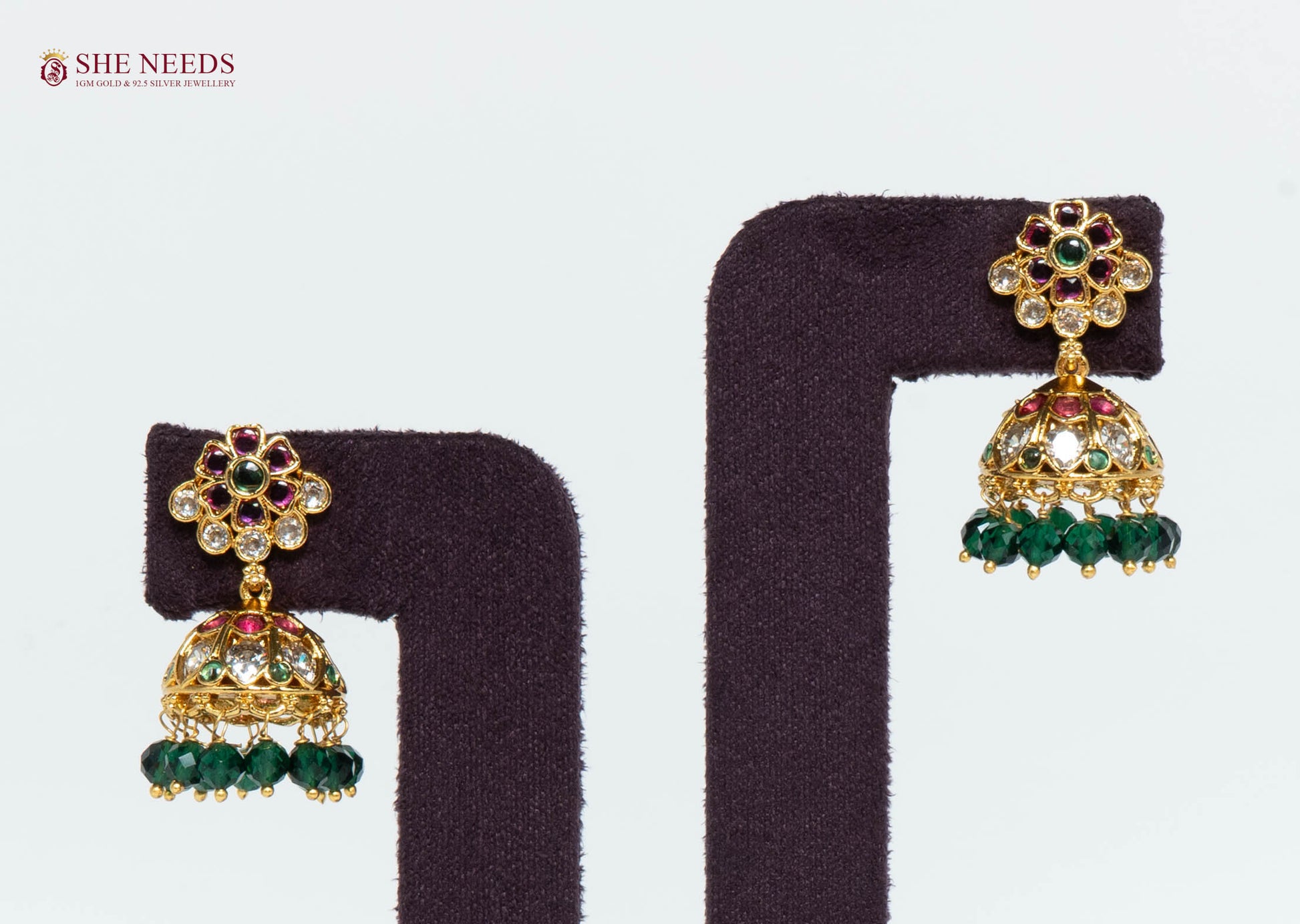Gold Plated Floral Jhumka Earrings with American Diamonds, multicolor stones and green crystal bead drops by She Needs Jewellery