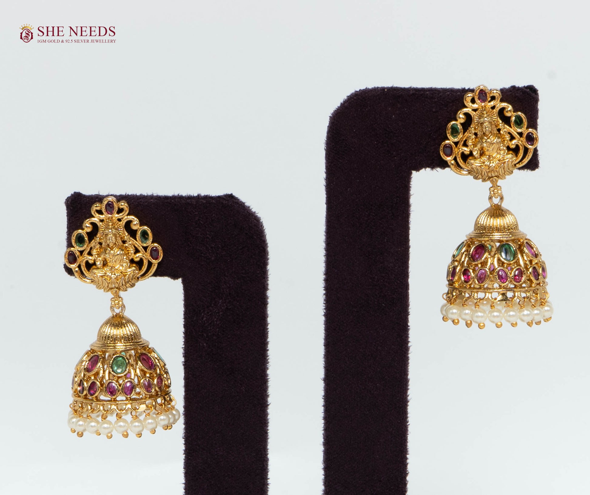 Gold Plated Temple Lakshmi Jhumka Earrings with Multicolor Stones, Pearl Drops and Lakshmi Design | She Needs Jewellery