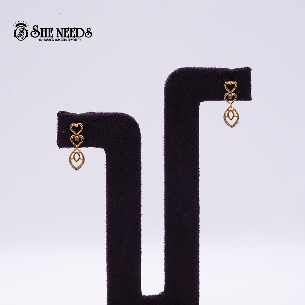Golden Heart Drop Earrings featuring double heart motifs, delicate openwork drop detailing, and a premium gold-plated finish.|She Needs Jewellery
