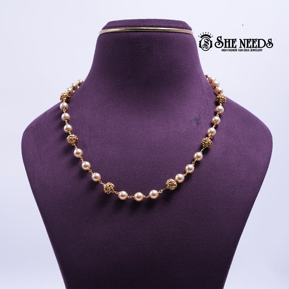 Golden Pearl Radiance Necklace featuring pearl beads, textured gold beads, and a premium gold finish | She Needs Jewellery