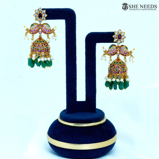 Pair of Kairavi Antique Gold Paisley Temple Jhumka Earrings with paisley design, ruby-colored stones, American Diamonds, pearl accents, and green bead drops.|She Needs Jewellery
