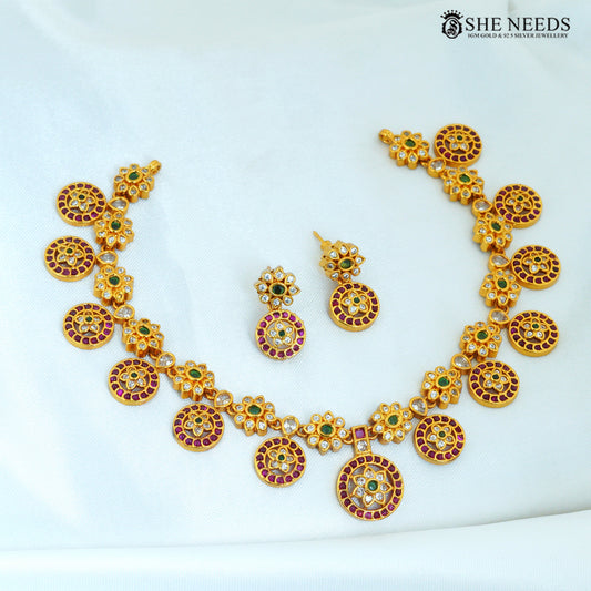 Kamalika matte gold plated short floral necklace with matching earrings and ruby green stone |She Needs Jewellery
accents