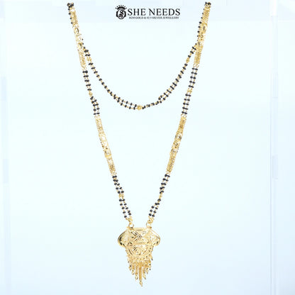Full view of Kamalini Gold Plated Traditional Mangalsutra with an engraved floral pendant, decorative tassels, and a traditional black bead chain.|She Needs Jewellery
