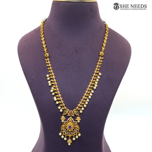 Antique Lakshmi double layer necklace with intricate temple motifs, green ruby stones and pearl drops|She Needs Jewellery
