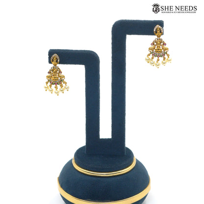 Lakshmi Pearl Cascade antique gold earrings with Goddess Lakshmi motif, ruby and green stones and pearl drops|She Needs Jewellery