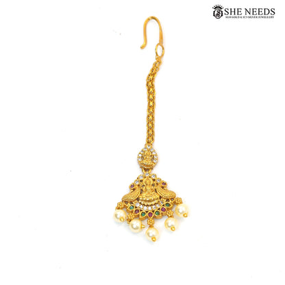 Lakshmi Pearl Cascade antique gold maang tikka with Goddess Lakshmi motif, colourful stones and pearl drops|She Needs Jewellery
