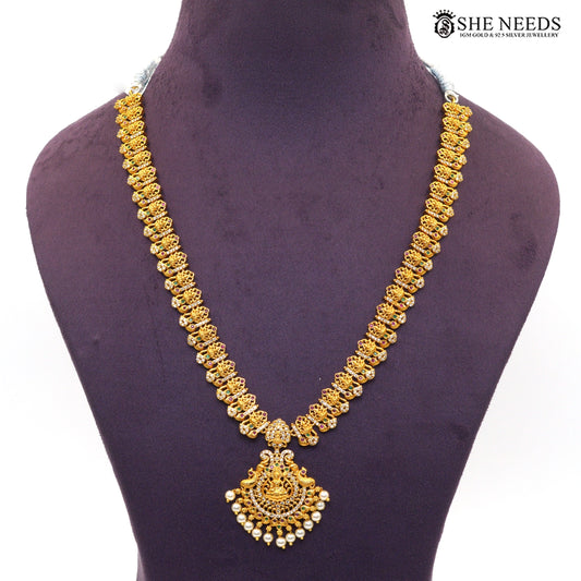 Antique gold Lakshmi temple double layer necklace with intricate motifs, colorful stones and pearl accents|She Needs Jewellery
