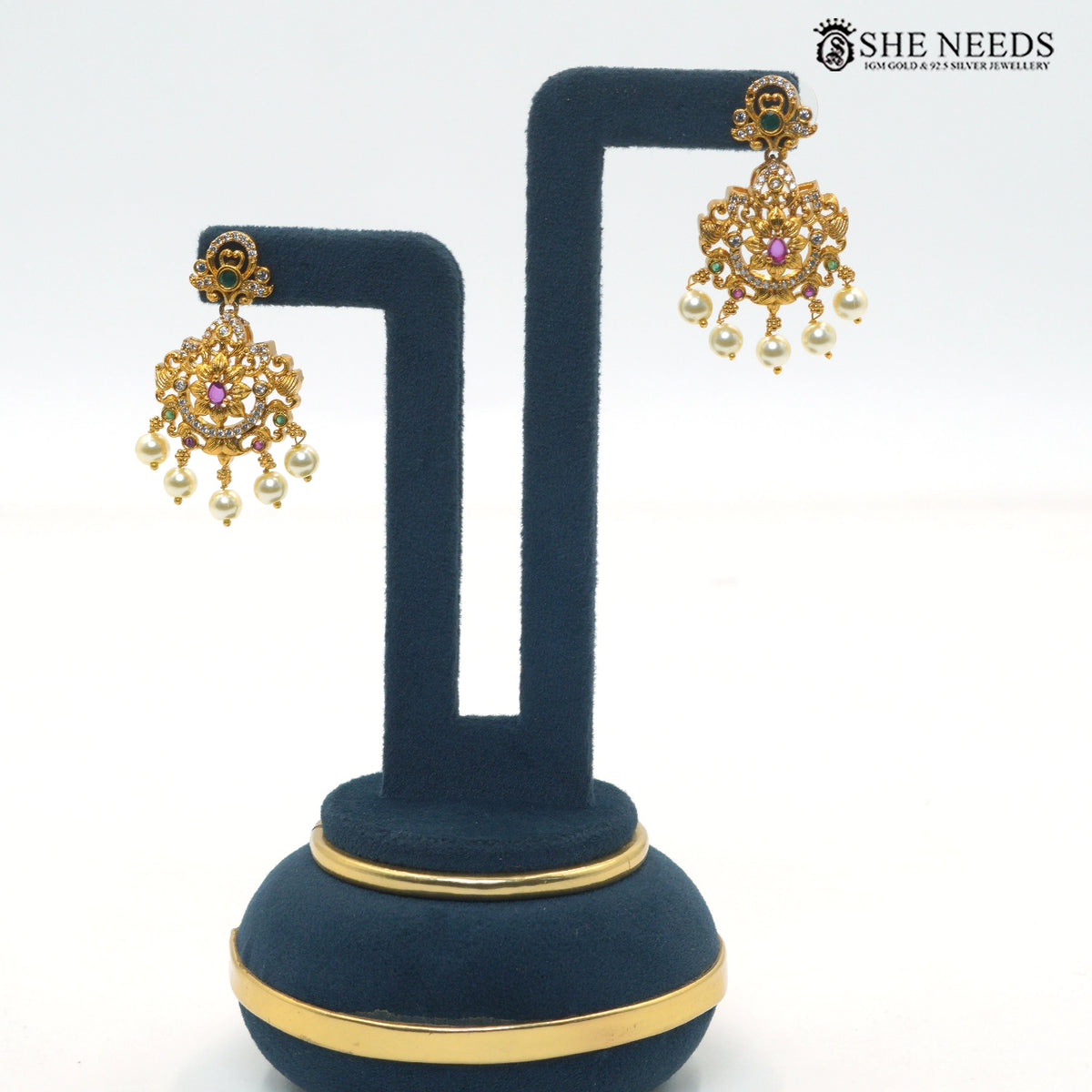 Matching antique gold Lakshmi temple earrings with colorful stones and pearl drop detailing|She Needs Jewellery
