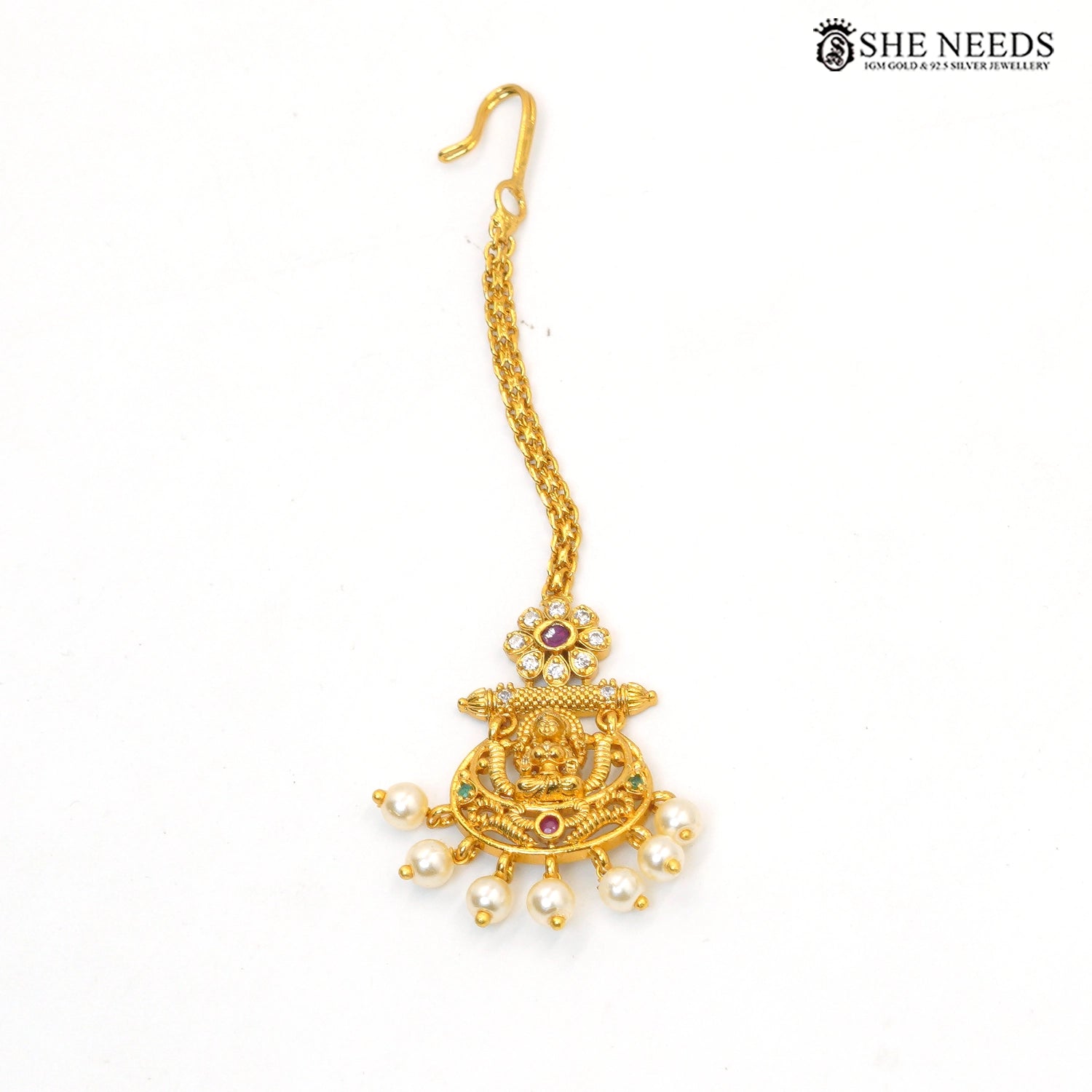 Traditional Lakshmi maang tikka with ruby and green stone accents and pearl drops|She Needs Jewellery
