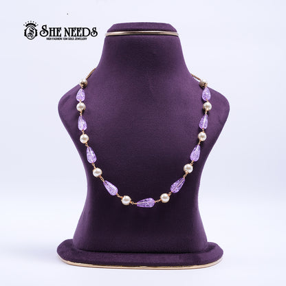 Lavender Pearl Elegance Necklace featuring faceted lavender crystal beads, pearl accents, and elegant gold-tone detailing.|She Needs Jewellery
