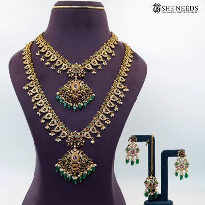 Majestic gold-plated peacock-inspired necklace set with green emerald-style beads, ruby accents, white stones, pearls and matching earrings|She Needs Jewellery