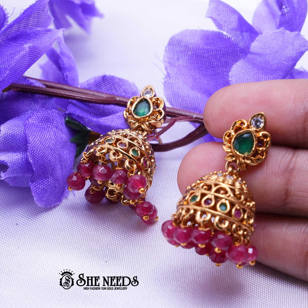 Mayura Antique Gold Jhumka Earrings with Green Stone & Ruby Beads | Festive Wear