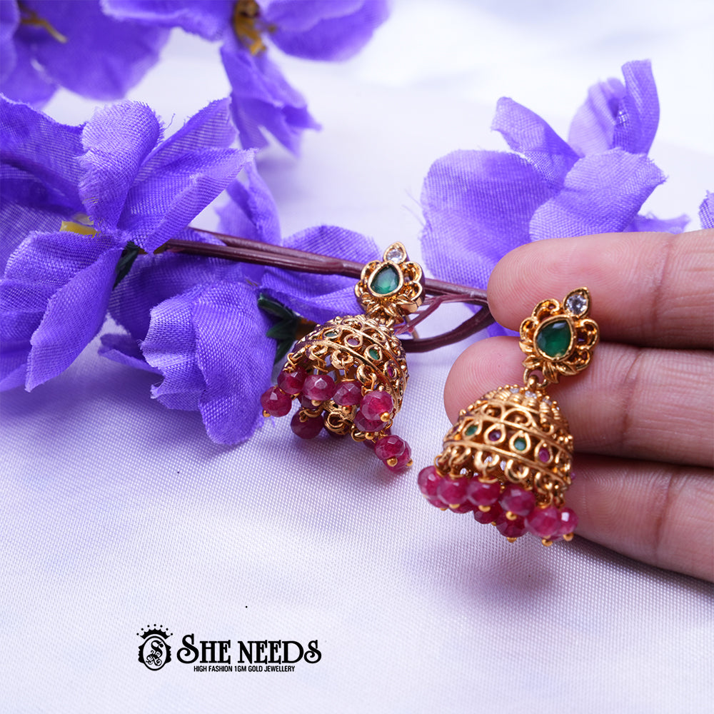 Mayura Antique Gold Jhumka Earrings with Green Stone & Ruby Beads | Festive Wear