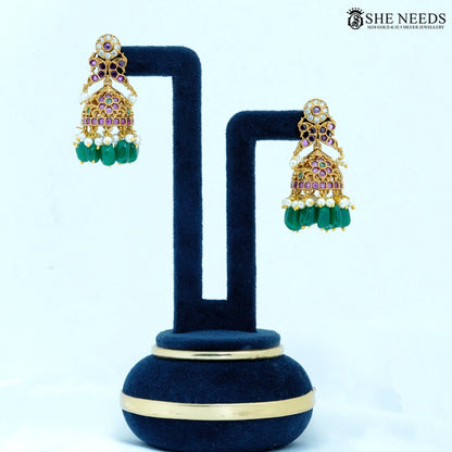 Pair of Mayura Antique Gold Peacock Temple Jhumka Earrings with Green Beads, American Diamonds and Ruby Stone Detailing|She Needs Jewellery
