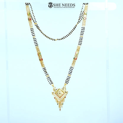 Full view of Mayuri Gold Plated Traditional Mangalsutra with a diamond-shaped engraved pendant, decorative tassels, side embellishments, and a classic black bead chain.|She Needs Jewellery
