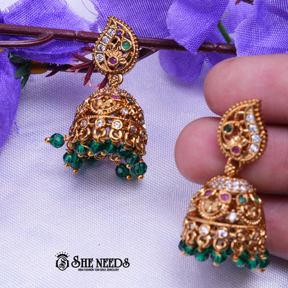 Antique gold jhumka earrings with CZ stones and Green Beads drops traditional jewellery by She Needs Jewellery